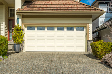 Naklejka premium Fragment of a luxury house with a garage door in Vancouver, Canada.