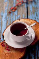 A cup of tea on a wooden background
