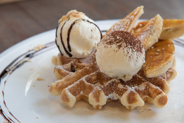 waffle with scoop of vanilla ice cream