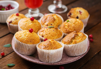 Tasty muffin (cupcake) with cranberries and cranberry-orange drink.