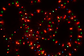 Fototapeta na wymiar Color christmas light blurred bokeh background, unfocused.