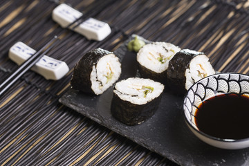  four rolls Sushi with lettuce, omelette, rice and nori outside
