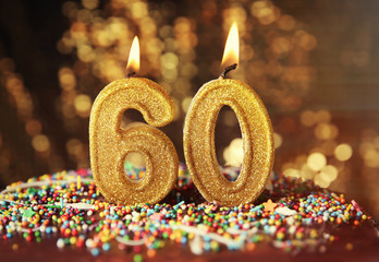 Birthday cake with burning candles on blurred background - obrazy, fototapety, plakaty