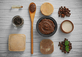 Coffee body scrub and soap on wooden background