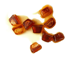 Iced coffee cubes on white background