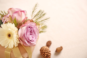 Handcrafted gift box with flowers on table