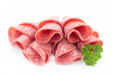 Salami sausage slices isolated on white background.