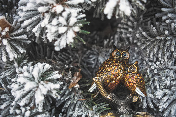 Оwl and owlet. Christmas toys on the Christmas tree