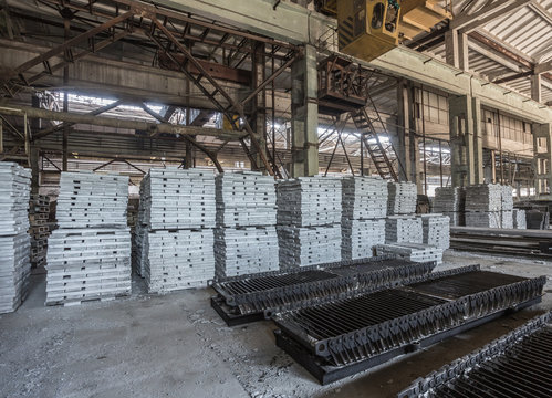 Stack of precast reinforced concrete slabs in a house-building factory workshop