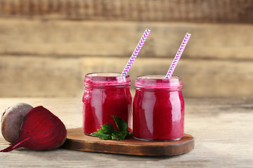 Fresh beetroot smoothie and vegetables on wooden wall background - obrazy, fototapety, plakaty
