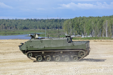 Fototapeta premium Armoured personnel carrier in the field