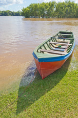 Fototapeta na wymiar Wood boat during a flood at Rio Pardo river