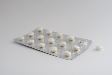 white pills in blister