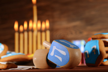 Close up view of dreidels for Hanukkah on wooden table