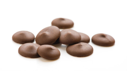 Fototapeta na wymiar Dark chocolate chips isolated on white background