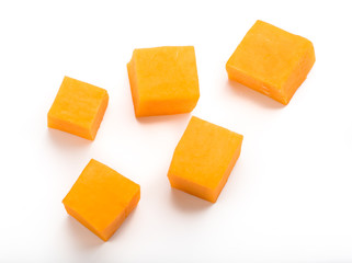 Pumpkin vegetable cube slice isolated on white background. Top view.