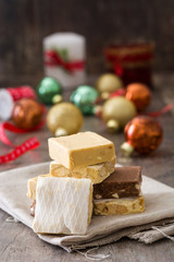 Christmas nougat and christmas decoration on wooden background
