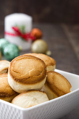 Christmas shortbread on wood and christmas ornaments
