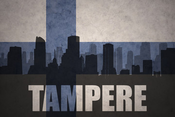 abstract silhouette of the city with text Tampere at the vintage finnish flag