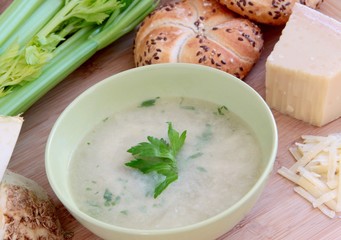 Vegetable celery soup with parmesan cheese and whole grain baguette.