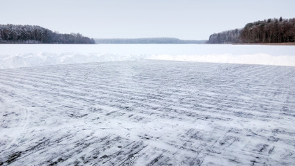 Skating rink on the ice of the frozen lake