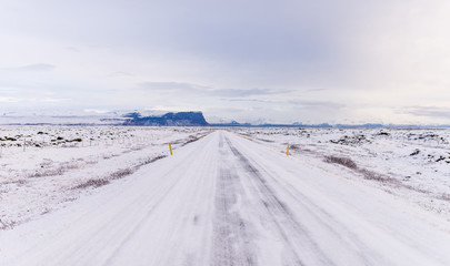 Highway 1 Iceland. Clear road covered in snow and ice