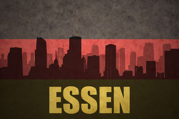 abstract silhouette of the city with text Essen at the vintage german flag