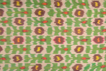 background from the tissue and textile with oriental ornaments and multi colored pattern