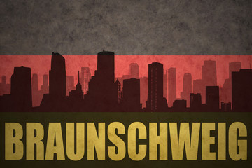 abstract silhouette of the city with text Braunschweig at the vintage german flag