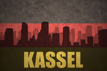 abstract silhouette of the city with text Kassel at the vintage german flag