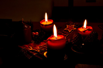 Romantic advent crown with three enlighted candles