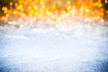 christmas xmas snow bokeh background with many lights and empty ice blue  snow copy space
