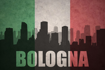 Fototapeta premium abstract silhouette of the city with text Bologna at the vintage italian flag