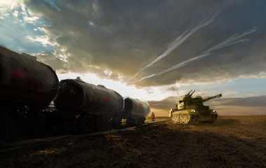 tank on field with protecting train 