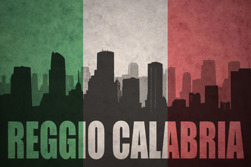 Fototapeta premium abstract silhouette of the city with text Reggio Calabria at the vintage italian flag