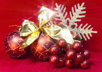 New Year's composition on a red background - ball and ribbon