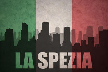 abstract silhouette of the city with text La Spezia at the vintage italian flag