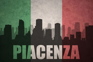 abstract silhouette of the city with text Piacenza at the vintage italian flag