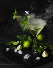 Martini or mint liqueur with lime, selective focus