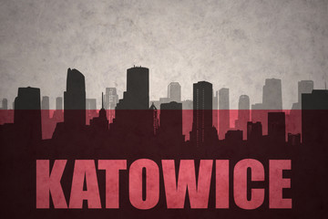 abstract silhouette of the city with text Katowice at the vintage polish flag