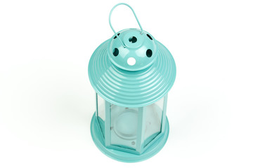 Light blue lantern. Candlestick in the form of retro lamp. White candle holder. An isolated object on white background. Top  view. Closeup.