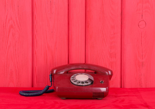 Vintage red phone on a red background