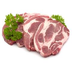 Raw pork neck chop meat with parsley herb leaves garnish isolate
