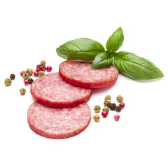 Salami smoked sausage three slices, basil leaves and peppercorns