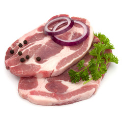 Raw pork neck chop meat with parsley herb leaves, peppercorn spi