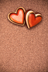Two wooden hearts on rustic wood background. Valentines days con