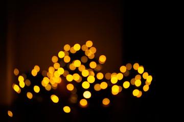Abstract christmas lights with warm golden tone in background.