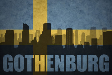 abstract silhouette of the city with text Gothenburg at the vintage swedish flag