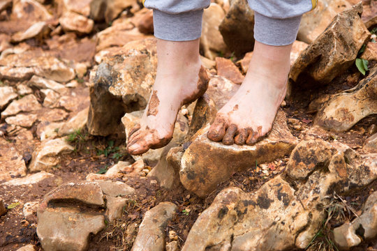 Medjugorje, Bosnia and Herzegovina on 2016/11/12. Female pilgrim walking barefoot to the top of Podbrdo Mountain (Mount of Apparitions).