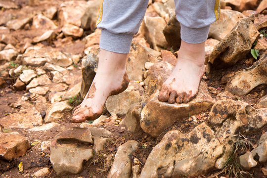 Medjugorje, Bosnia and Herzegovina on 2016/11/12. Female pilgrim walking barefoot to the top of Podbrdo Mountain (Mount of Apparitions).